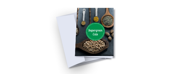 Example of a greeting card lying on top of a closed, white envelope. The greeting card contains a green circle with 'supergreen eats' written in white overlaid on an image of a table full of food ingredients. One of the greeting card templates available from Hatch.