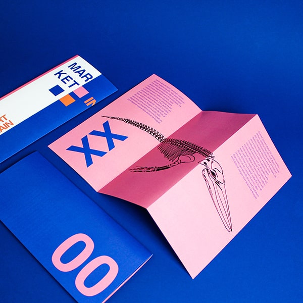 An open bi-folded leaflet printed by Hatch on a red and blue background and words ‘from £24’ inside a circle next to it